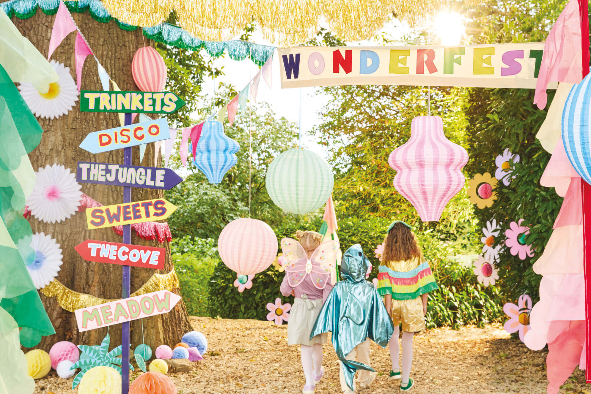 A festive kid's party set up with adorable and modern decorations with kid's dressed up entering the party