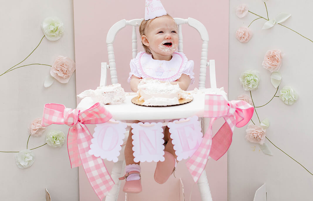 Girl's First Birthday Party on High Chair Smashing Cake