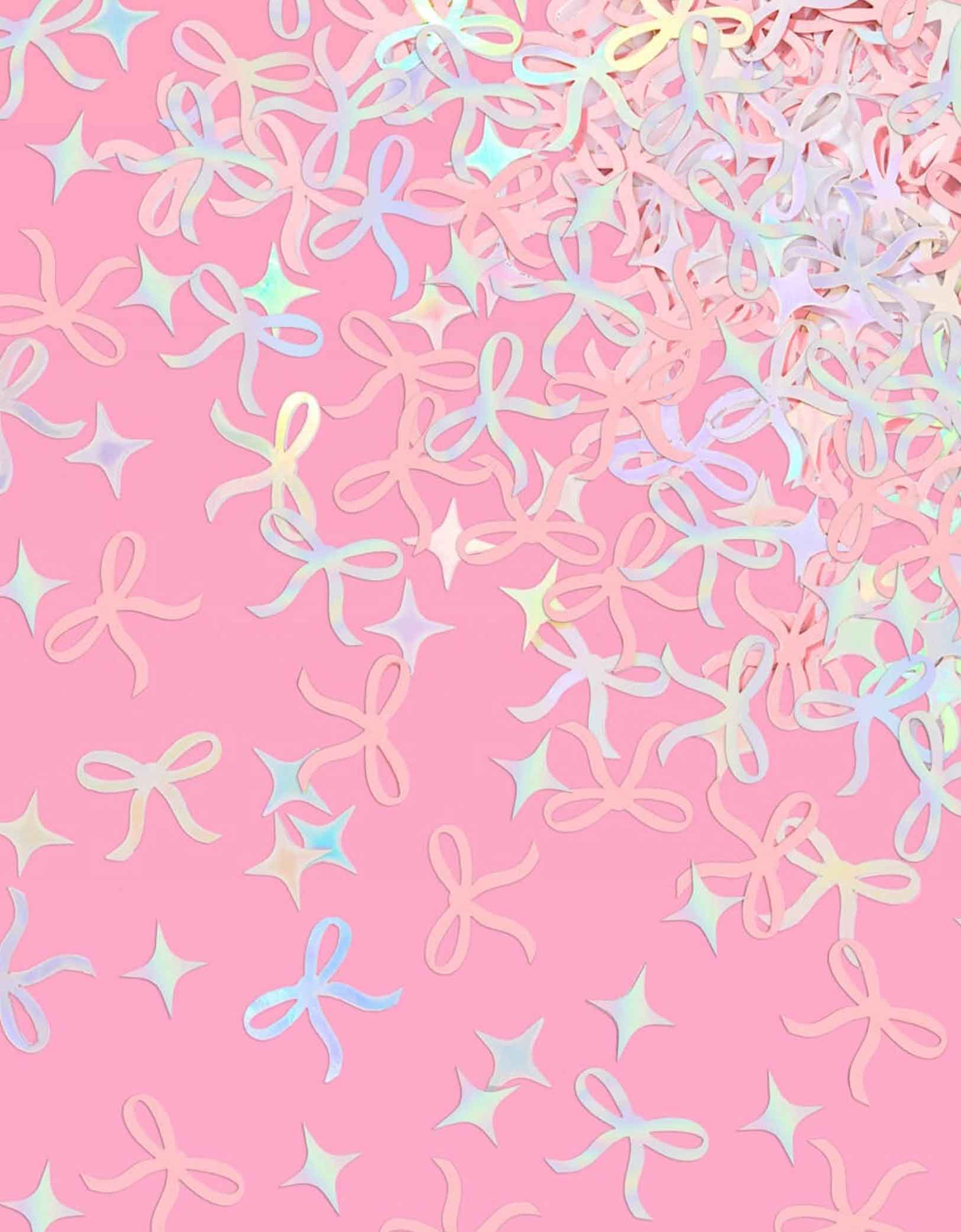 Momo Party's bow shaped confetti and star point shaped confetti in pink and iridescent on a pink background.