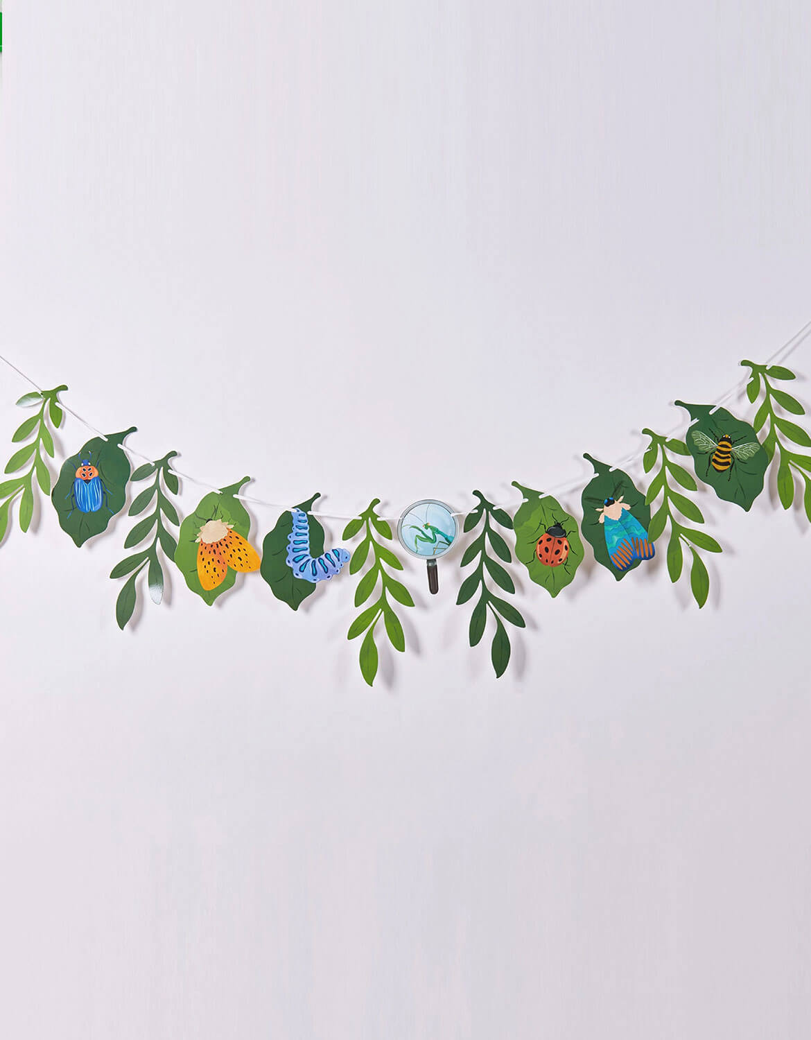 Momo Party's bugs themed party garland with leaf and insect designs on a white background.