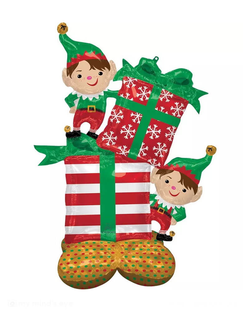 Momo Party's 36" x 53" Christmas Elves AirLoonz Foi Balloon by Anagram Balloons. Featuring a pair of elves who are accompanied by two large gifts dressed in classic green, red, and white wrapping, this jumbo foil balloon is perfect for setting a festive scene at your Holiday event or gathering.