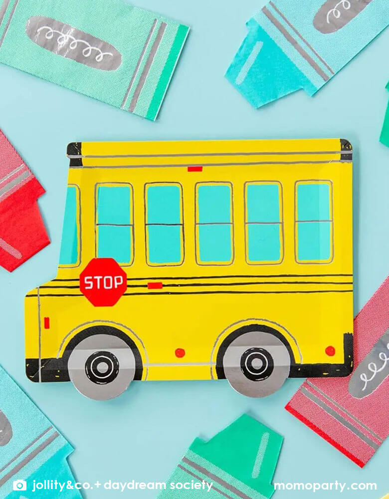 Momo Party's school bus shaped plates with colorful crayon shaped napkins around the plate. With festive colors and fun illustration style, this is perfect for a back to school party or kid's first day of school celebration!