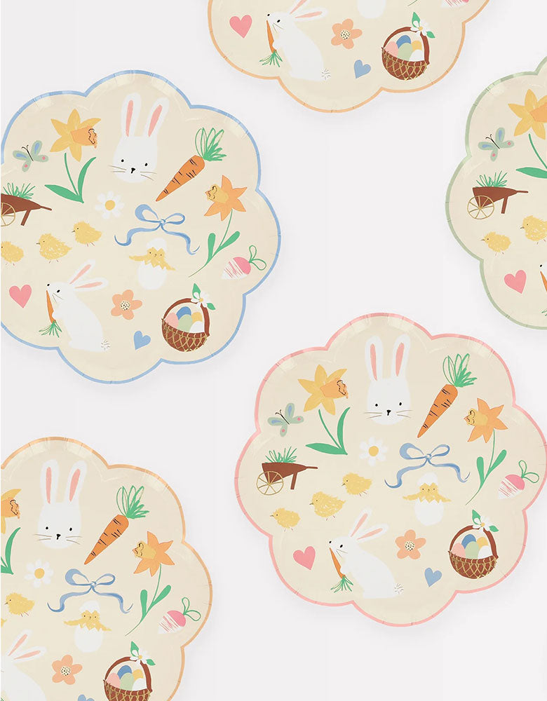 Momo Party's 8.5" Easter Icons Side Plates by Meri Meri. Comes in a set of 8 paper dinner plates in 4 colors on the boarder: pink, orange, mint, and blue, these scallop edged dinner plates feature iconic Easter themed illustrations including Easter bunnies, carrots, chicks, butterflies, flowers, bows, Easter basket, Easter eggs, and daisies. These charming dinner plates will look great for your little ones at this year's Easter celebration.
