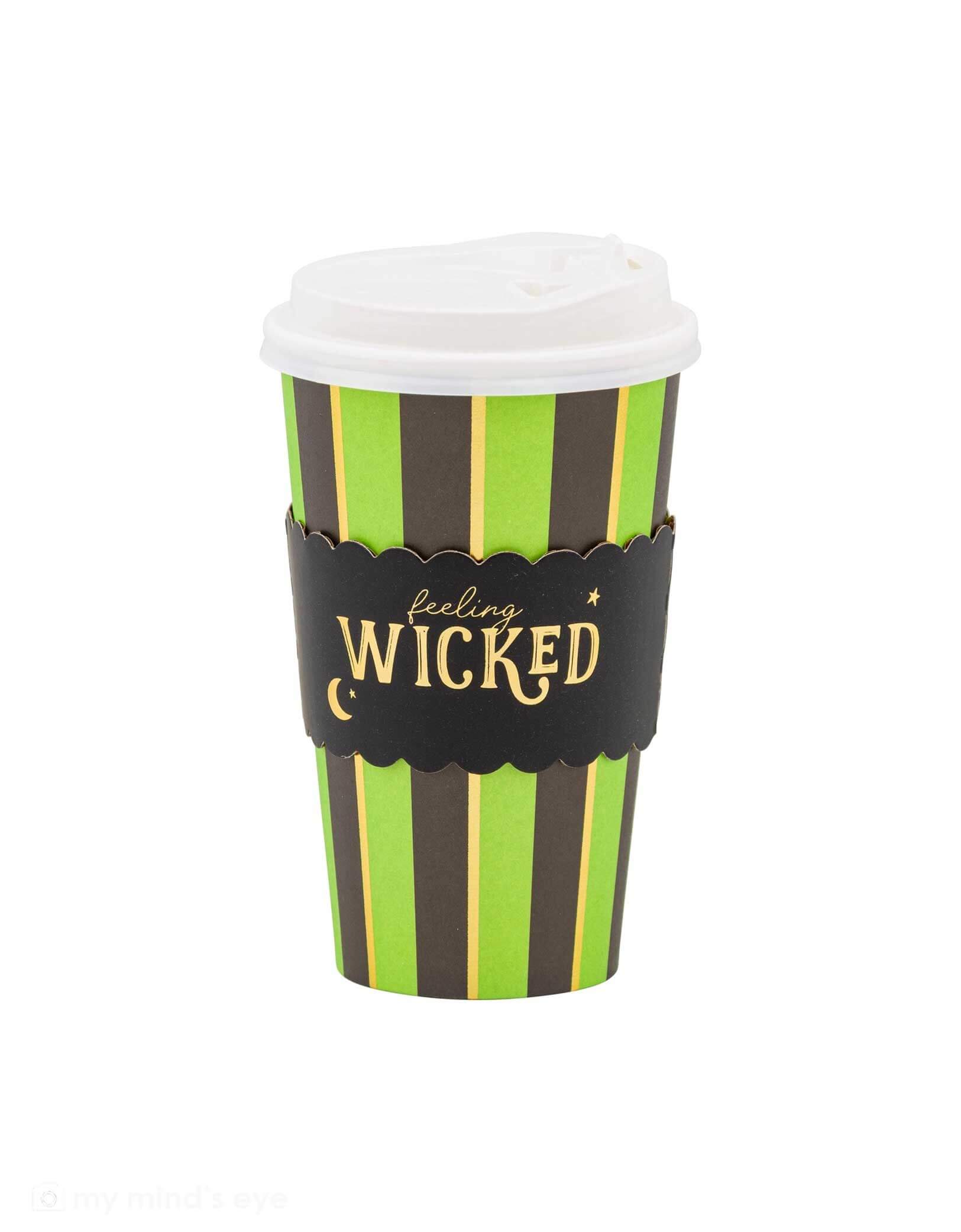 Momo Party's 12oz Feeling Wicked To Go Cup by Mind Mind's Eye on a white background. Featuring the classic Wicked colors of green and black with gold foil details, this to-go cup is perfect for breakfast on the go, these green witch-themed cups add a spooky touch to your party drinks. Durable and festive, they keep your beverages stylishly contained while setting the mood for a magical celebration.