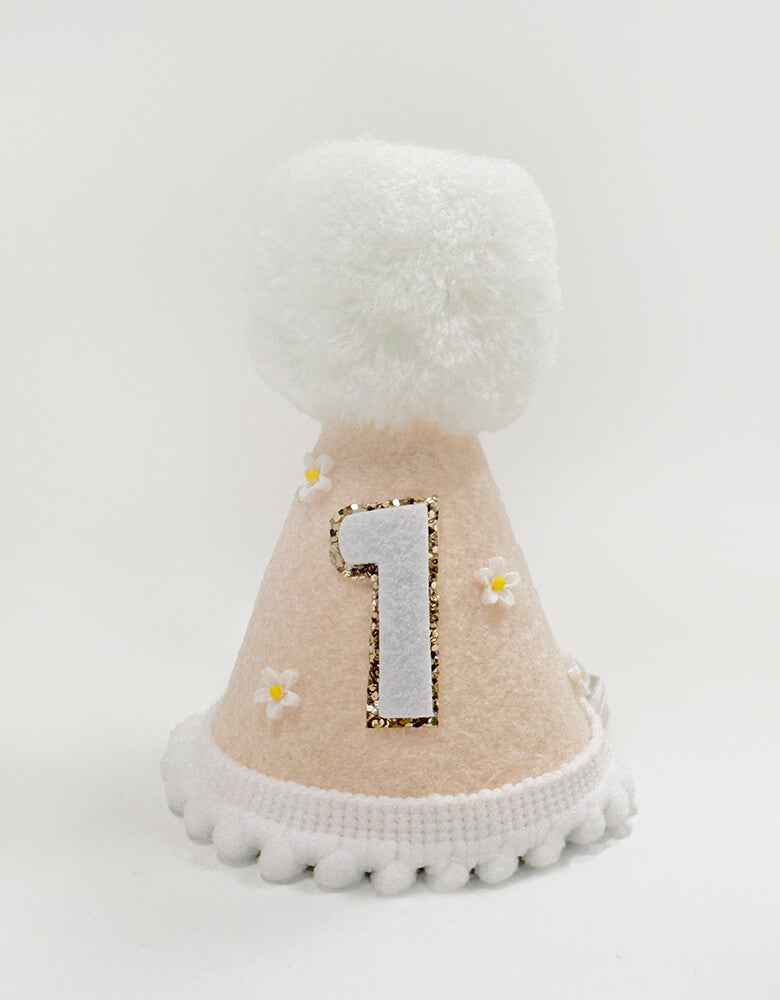 Flower felt first birthday hat for girls from momoparty.com. Adorned with cute tiny flowers and playful white pom poms and Number one with gold glitter. This peach color felt hat adds the perfect touch of cuteness to any party outfit. A must-have for any girl's special day.