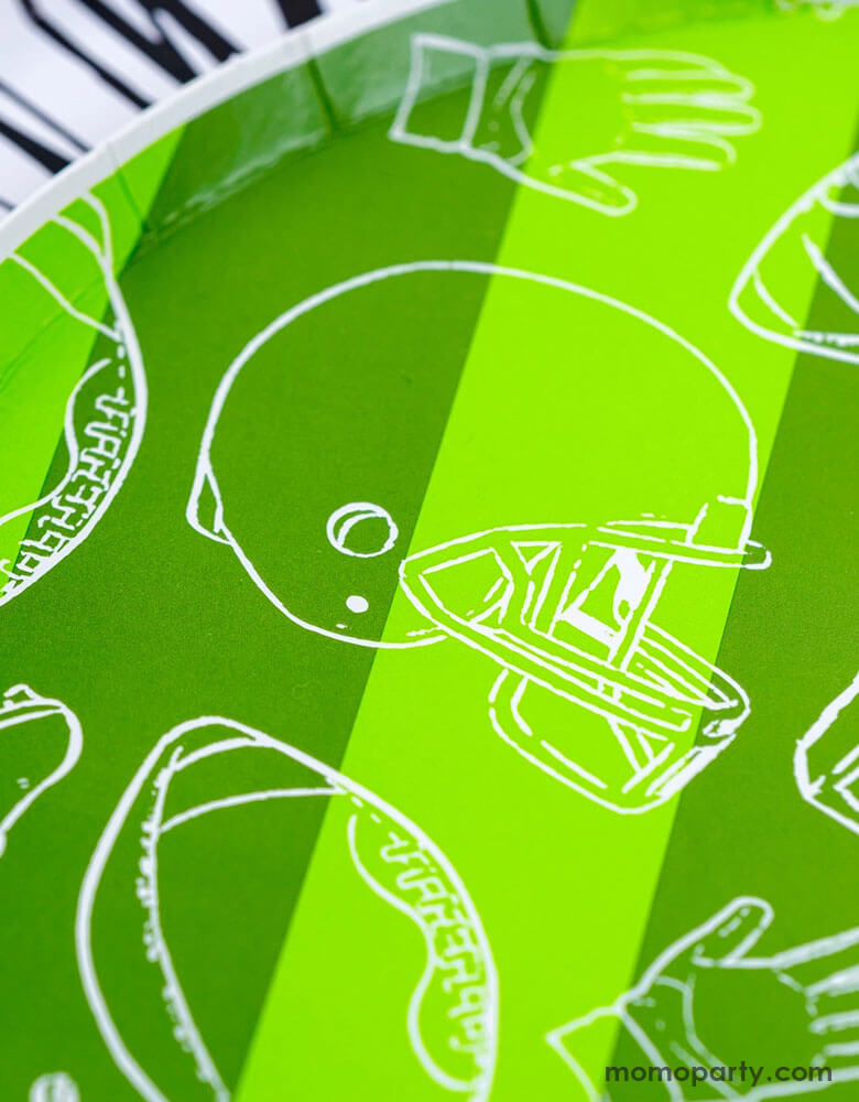 A closer look of Momo Party's 8.5" Touchdown Dessert Plates by Gatherings. Elevate your game day celebration with these touchdown plates! These sturdy and stylish plates are the perfect addition to your football-themed party. With a unique design and high-quality materials, you and your guests can enjoy your favorite treats with ease. Score a touchdown with these plates and make your party a winner!