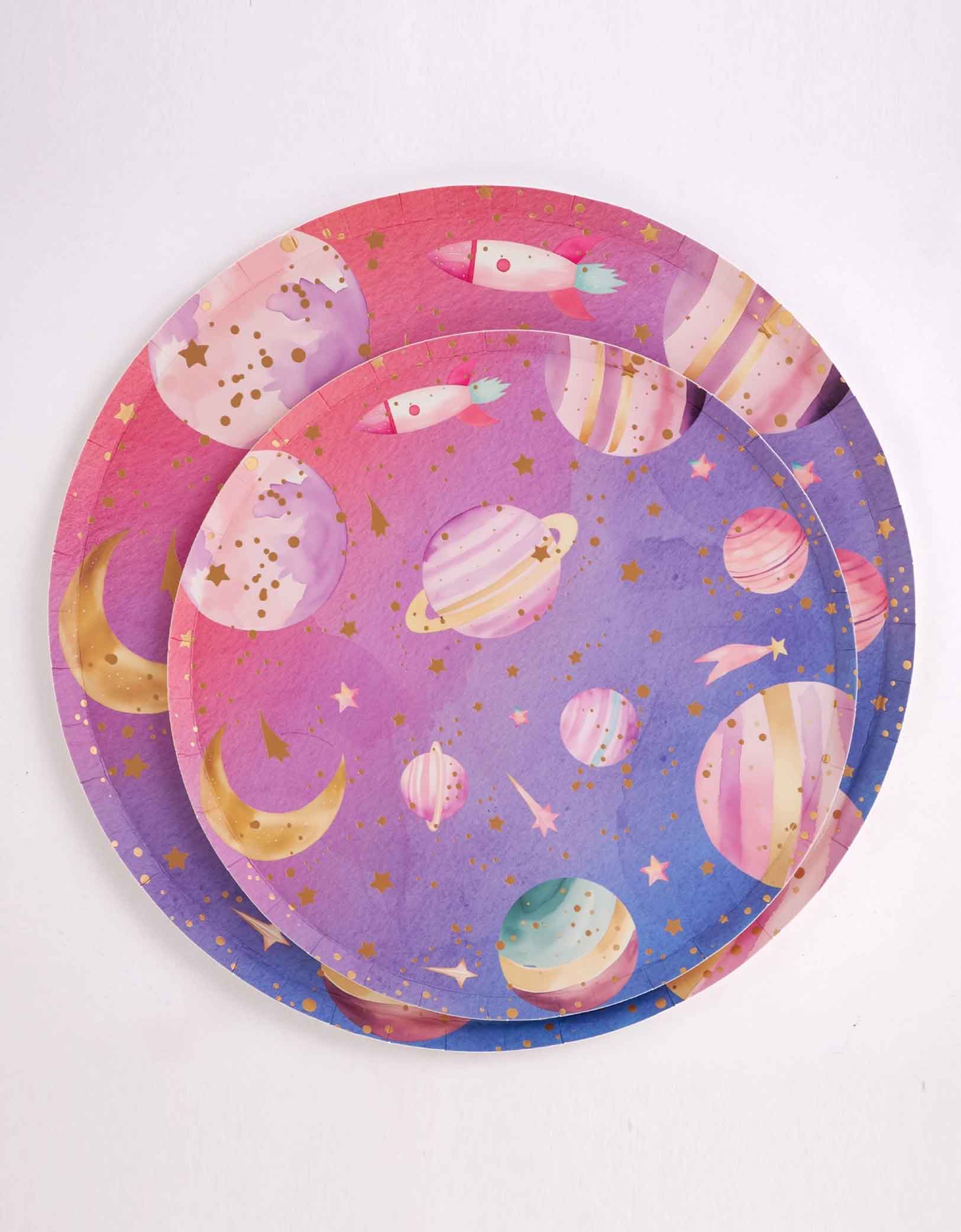 Set of two sizes of Momo Party's 10" * 8" round lilac and pink ombre plates with space-themed design featuring planets and stars on a white background.