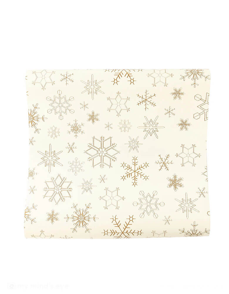 Momo Party's 16" x 120" Gold Flakes Paper Table Runner by My Mind's Eye.Featuring stunning gold snowflakes, it's the perfect way to create a festive atmosphere. Make your celebrations shine! 