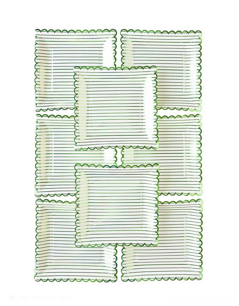 Momo Party's 9" x 9" Green Striped Paper Plates by My Mind's Eye. Comes in a set of 8 plates, these scallop edged paper plates with a green stripe foil are perfect for kid's dinosaur, jungle themed party. They're great for bringing a little extra luck to your St. Patrick's Day festivities!