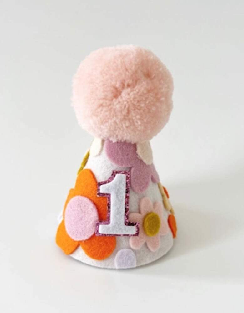 Groovy One Felt First Birthday Hat for girls from momoparty.com. Adorn with felt handcut daisies in retro inspired colors, this birthday hat adds the perfect touch of cuteness to any party outfit. A must-have for your girl's "One Groovy Baby" themed first birthday!