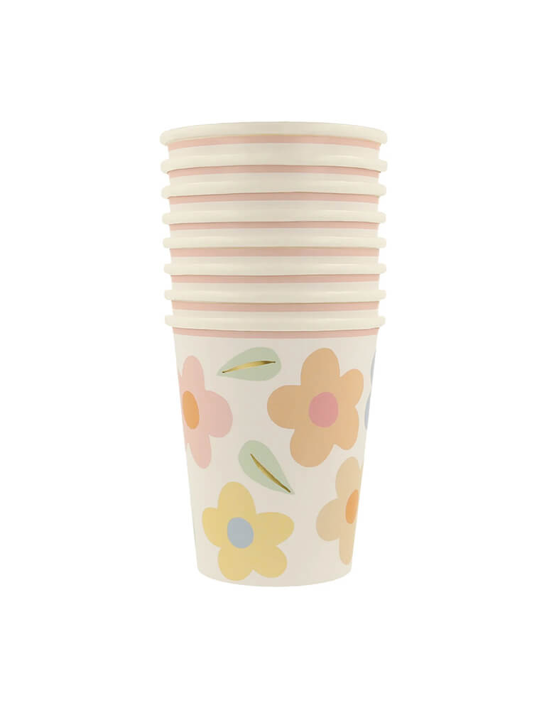 Momo Party's 9oz happy flower party cups by Meri Meri. This adorable set of 8 cups features pastel daisy patterns that will transport you back to the 90s. Perfect for any flower lover, these cups are sure to bring a smile to your face.