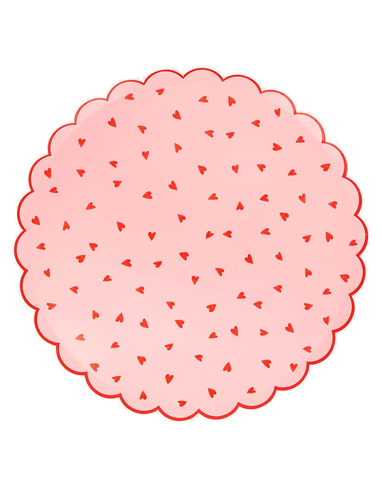 Momo Party's 10.5 x 10.5 inches Pink and Red Heart Pattern Dinner Plates by Meri Meri. With a scalloped border and small red heart pattern on the pink background, this set of plates are perfect for your sweet Valentine's Day, Galentine's Day celebration.