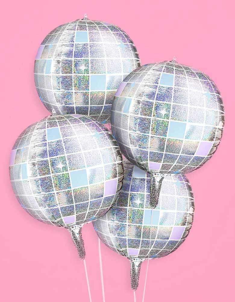 Momo Party's 22" Iridescent Shimmer Disco Ball Foil Balloons by Xo, Fetti. Make the whole place shimmer with these absolutely bejeweled disco ball shaped balloons. Perfect for your photo backdrop - this balloon set polishes up real nice. Each set comes with 4 disco ball 22" foil balloons Iridescent, mirrored printed finish balloons include a self-sealing valve, preventing the gas from escaping after it's inflated. The balloon can be inflated with helium to float or with a balloon air inflator.