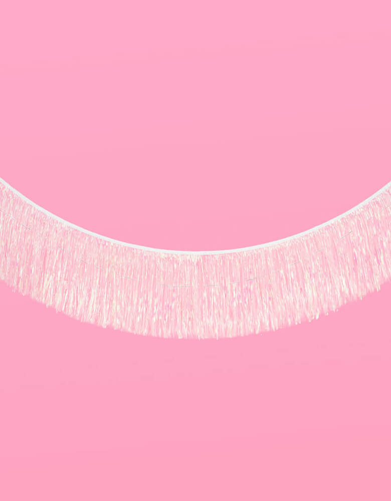 Momo Party's 5' Iridescent Tinsel Fringe Garland by Xo, fetti. This pre-strung foil fringe banner is perfect to set a scene for your party photo backdrop. Perfect for kid's mermaid, unicorn themed birthday party or a preteen, teenager's dance party!