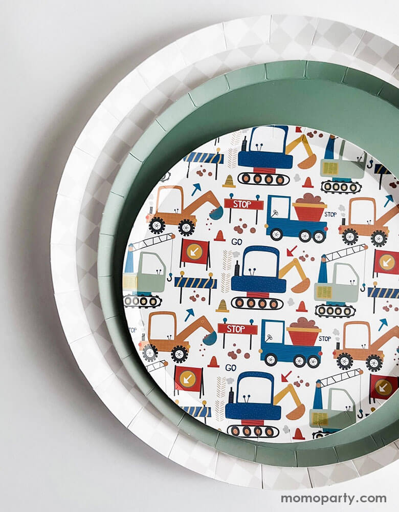 A festive kid's construction themed party placeset idea featuring Momo Party's 10.25" light grey checkered dinner plate, 9" olive green large plate and a round side paper plate with motif of various construction trucks in multiple colors by Josi James. This set is perfect for preschool boy's construction themed party, a fun dirty-3rdty themed birthday bash!