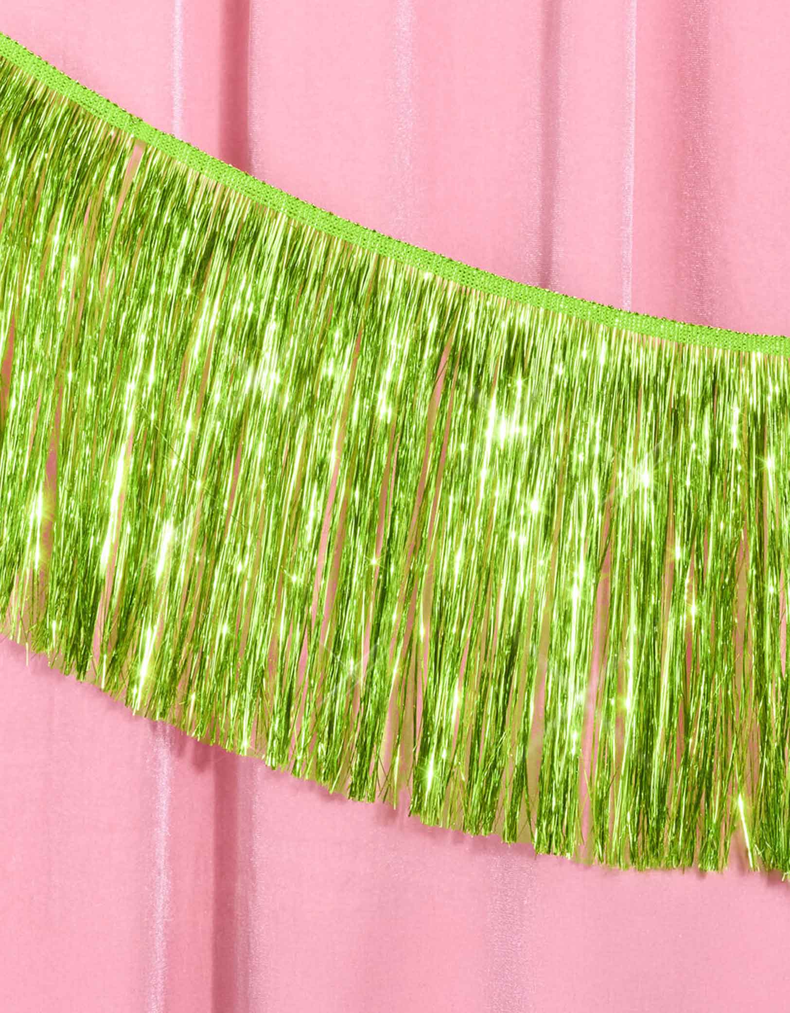 Momo Party's 4.43 feet Lime Green Fringe Garland by Xo, Fetti. Perfect for any celebration, it'll add just the right touch of shimmer. You'll love it for Wicked themed celebration or kid's safari, dinosaur themed birthday parties!