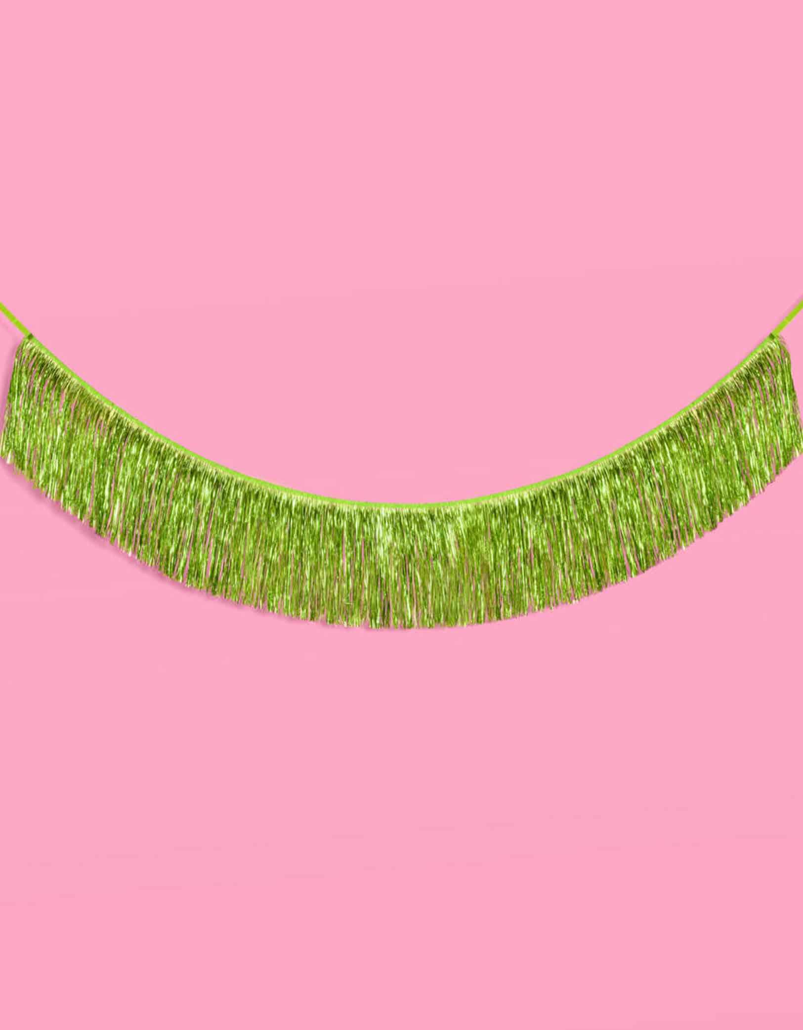 Momo Party's 4.43 feet Lime Green Fringe Garland by Xo, Fetti. Perfect for any celebration, it'll add just the right touch of shimmer. You'll love it for Wicked themed celebration or kid's safari, dinosaur themed birthday parties!