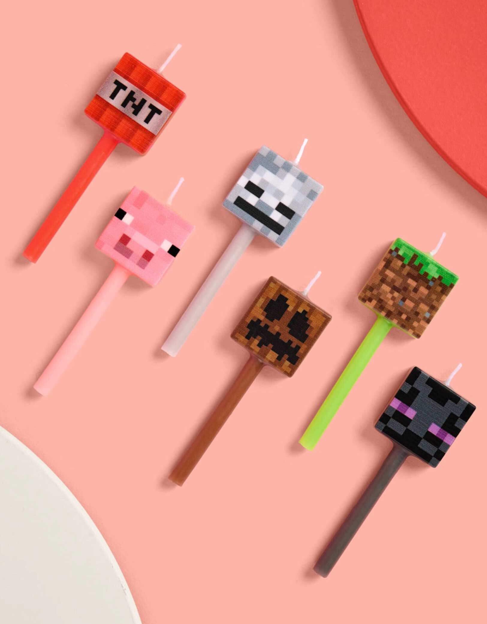 Set of Momo Party's 3" Minecraft-themed birthday candles featuring TNT, pig face, Enderman and pixel faces on a pink background.