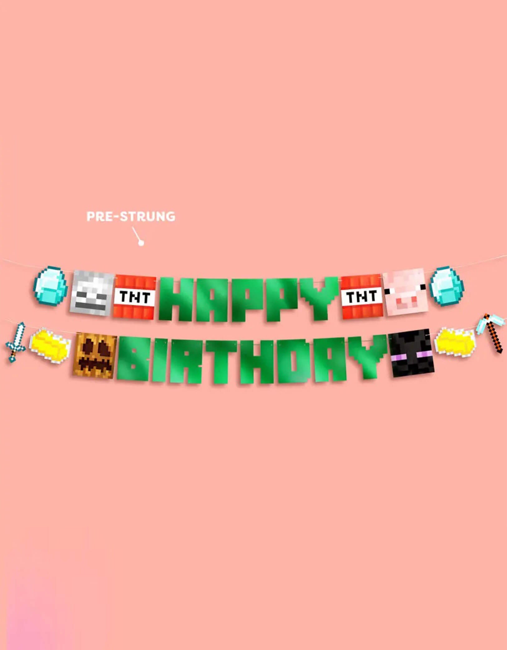 Momo Party's 6ft Minecraft Pixel Birthday Banner with pixelated pennants including TNT, a pink pig block, a diamond block, and other Minecraft-style blocks and green foiled happy birthday pennants on a pink background.