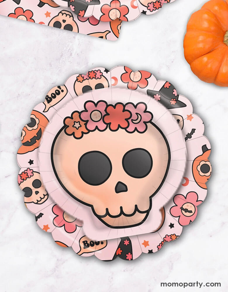 Momo Party's 8" Groovy Halloween Icon Plates and Skull plates by Ellie's Party. These scalloped-shaped, groovy halloween icon plates are perfect for Halloween. Your guests will absolutely love these plates. Pair our chic halloween plates with skull-shaped dessert plates, halloween napkins, and cups for a cute and stylish table setting. Featuring groovy pumpkins, skulls, flowers, and witch hats, these plates are perfect for your next halloween or fall birthday party!