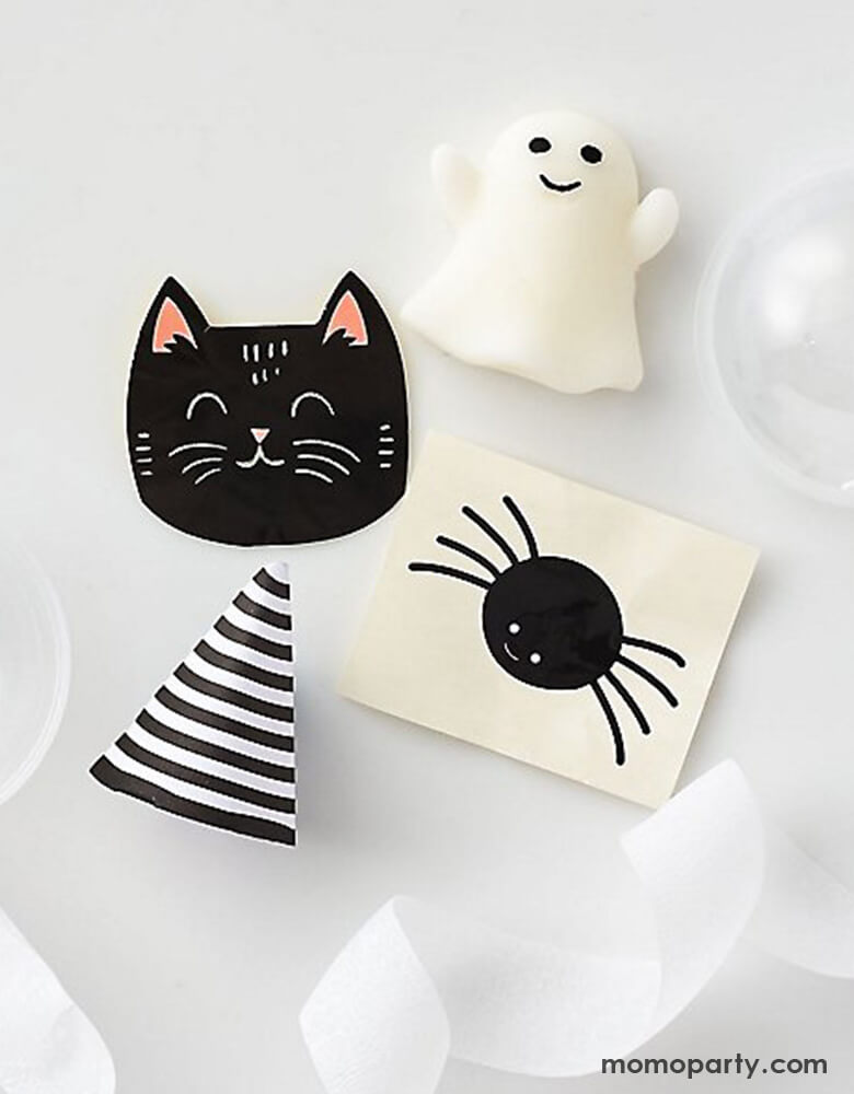 Halloween Character Surprise Balls by Paper Source. Features a cat, ghost, spider and pumpkin with a surprise in each- a glow sticker, squishy toy and spider tattoo. These make a great party favor or decor for your Halloween tabletop.