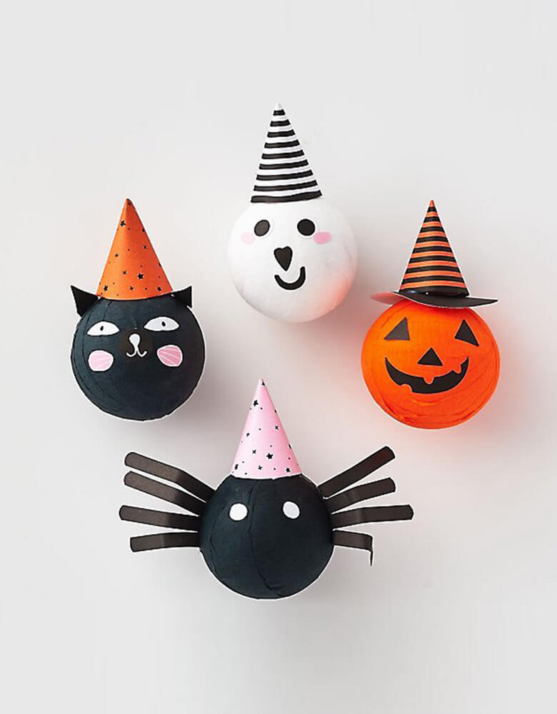 Halloween Character Surprise Balls by Paper Source. Features a cat, ghost, spider and pumpkin with a surprise in each- a glow sticker, squishy toy and spider tattoo. These make a great party favor or decor for your Halloween tabletop.