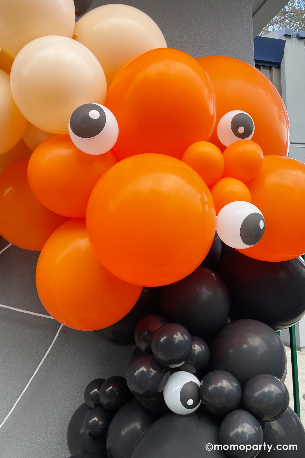 Halloween balloons by Momo Party in orange, blush, and black with qualatex' 5" eyeball balloons, it creates a spooky yet adorable decoration for kid's Halloween themed party or trick-or-treat celebration.