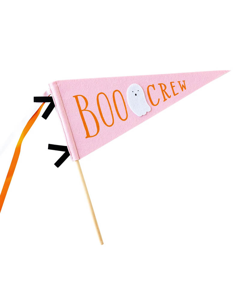 Momo Party's 14" x 15" pink Boo Crew felt party pennant by My Mind's Eye. In a pink Halloween hue, this felt party pennant with an adorable ghost illustration on it and orange and black ribbons, it will make sure your ghouls get the recognition they deserve.