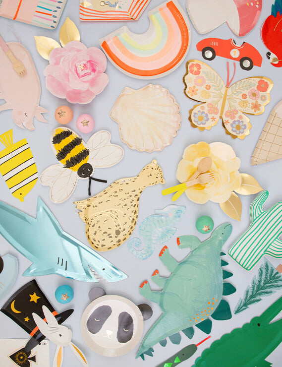 Table fill with Meri Meri Fun die cup party plates of Dinosaur, Cheetah, Shell, Bee Flowers, Butterflies, Cactus, and Napkins, sale by Momo Party online boutique store