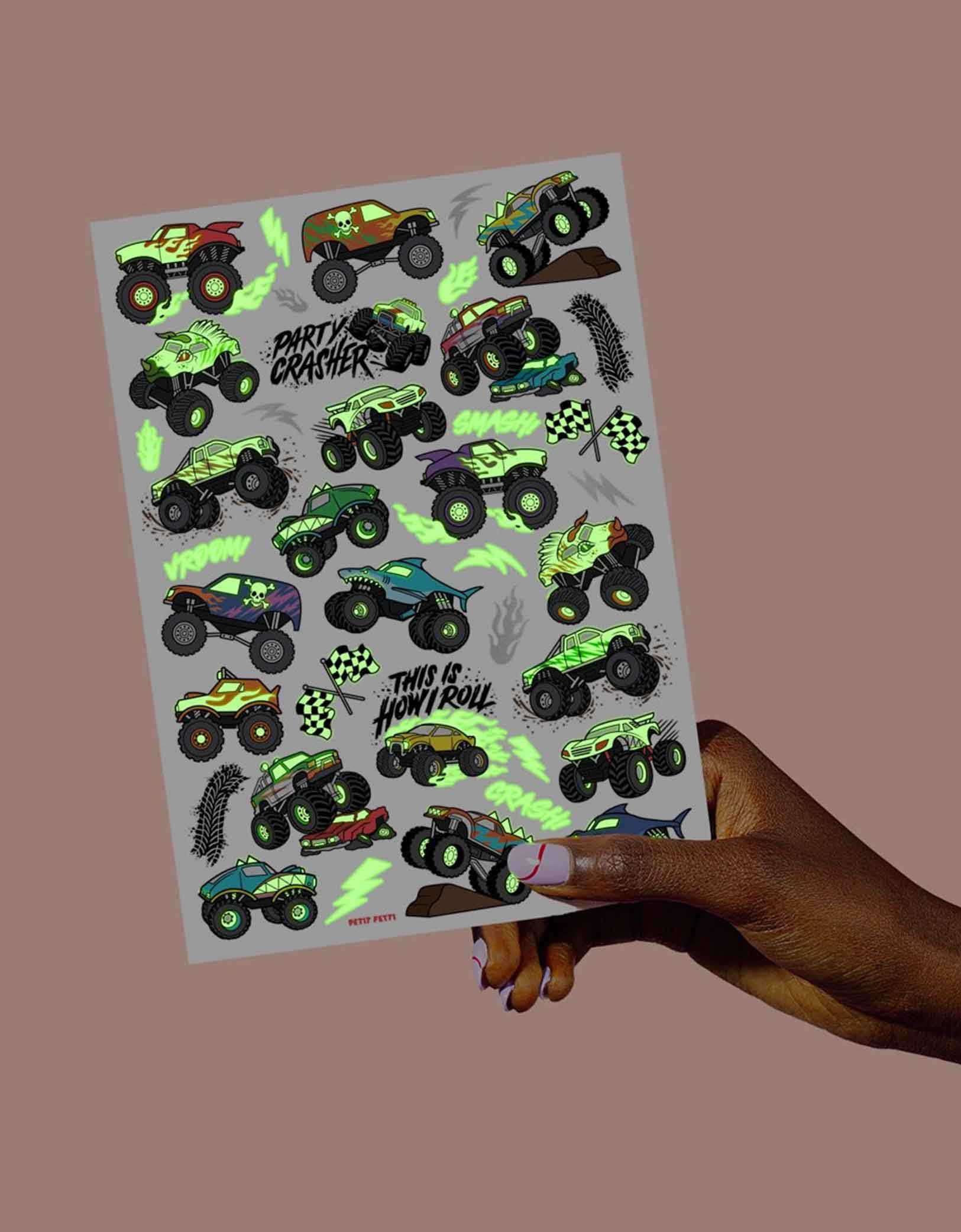 Momo Party's 8.25" x 6" Monster Truck Glow in the Dark Kids Temporary Tattoos by xo, fetti. Comes in a set of 50 tattoos, these awesome glow-in-the-dark Monster Truck temporary tattoos are guaranteed to be a wheel good time at your kid's Monster Truck birthday party! 50 designs means nobody gets left behind - invite all of your bffs to crash this party because these tats are sure to be fire!