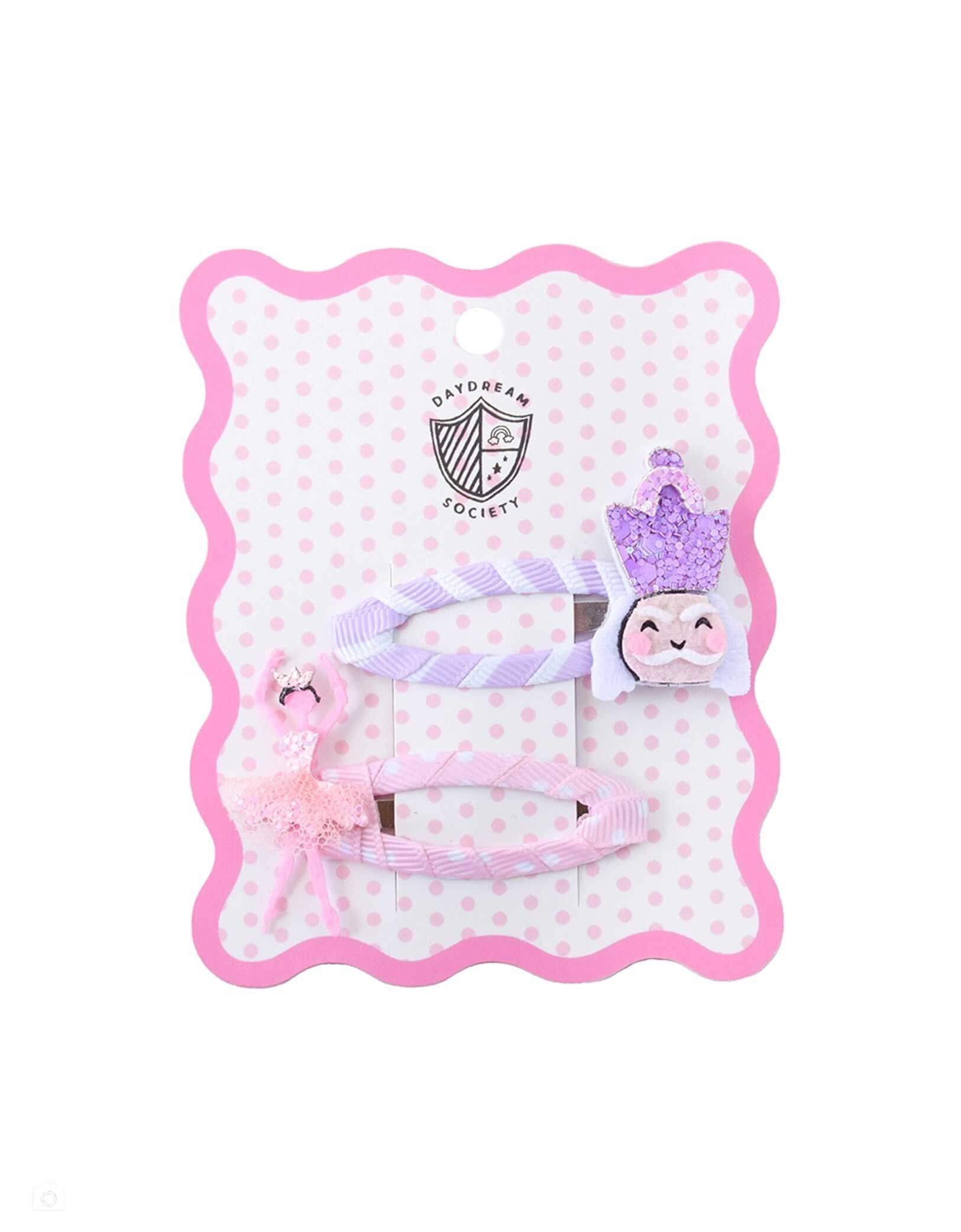 Momo Party's Christmas glittered Nutcracker and Sugar Plum Fairy Ballerina hair clip set accessories on a pink polka dot card with Daydream Society logo on it on a white background. This set of whimsical hair set is perfect for your child's holiday gift or stocking stuffer.