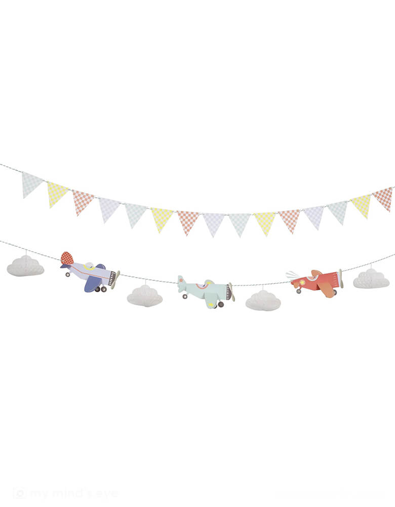 Momo Party's 7' Planes Garland by Meri Meri. This set splits across 2 strings for easy hanging - 3 Airplanes with 3D wing details and 4 White tissue paper honeycomb clouds with silver metallic thread. And 8 White paperclips to hold the honeycomb clouds open on a mint and white bakers twine. This plan garland sets a perfect scene for your kid's airplane or aviator themed birthday party.