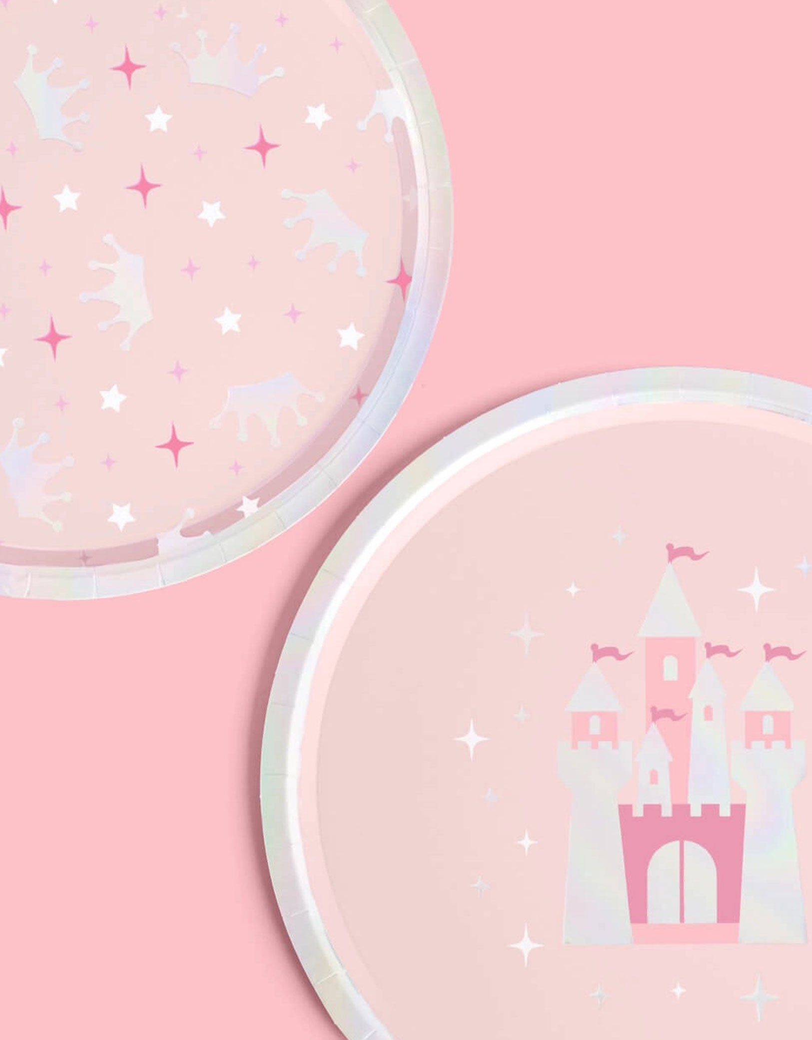 Two Momo Party's 9" princess iridescent round party plates in two designs each featuring a pink castle design and crowns and star point patterns on a pink background.