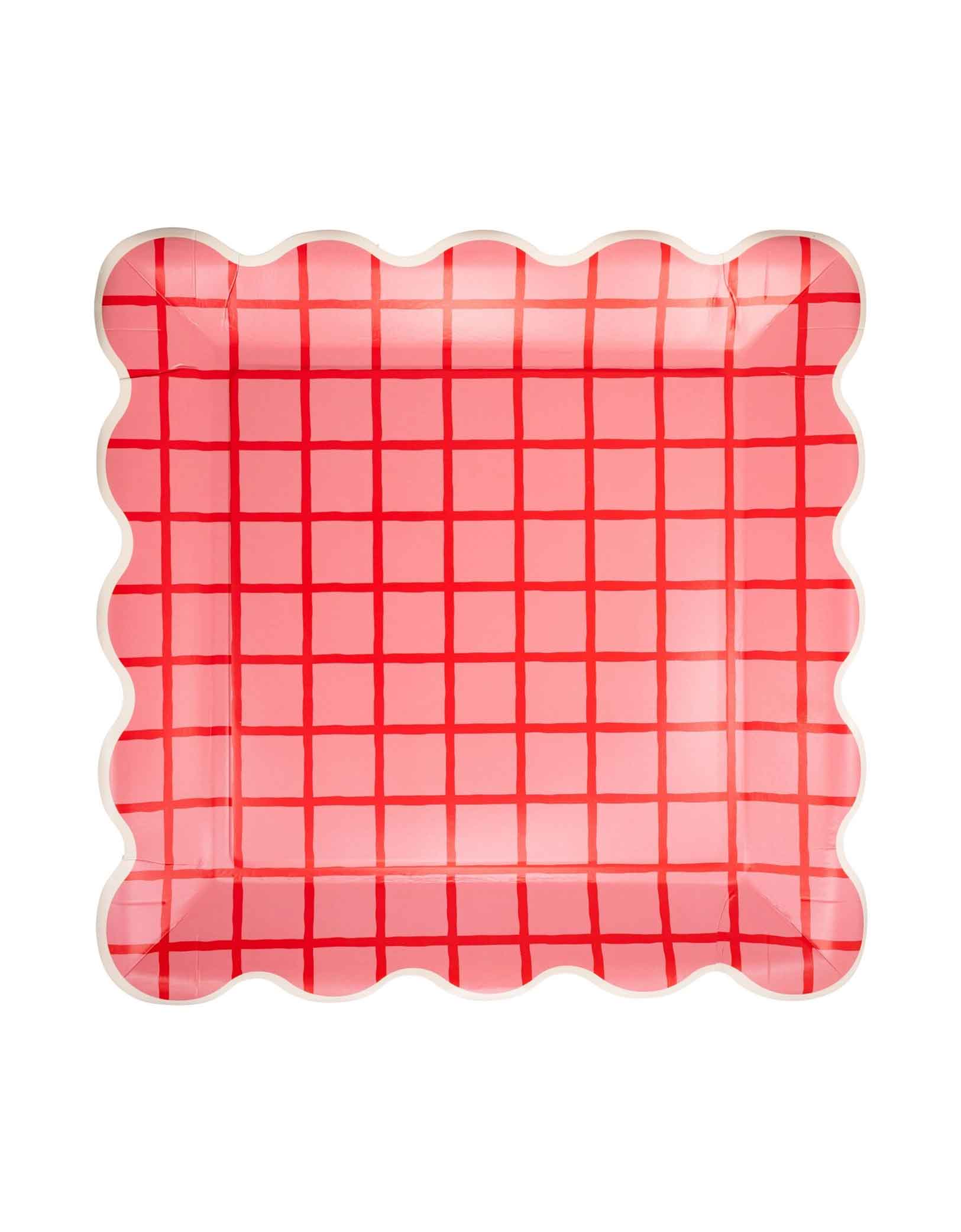 Momo Party's 10" Red and Pink Grid Scallop Square Plates by My Mind's Eye on a white background. Featuring a cheerful grid design in red and pink hues and charming scalloped edges, these plates bring a coordinated and festive vibe to your table. Perfect for serving snacks, desserts, or appetizers, they help create a lively atmosphere for any celebration.