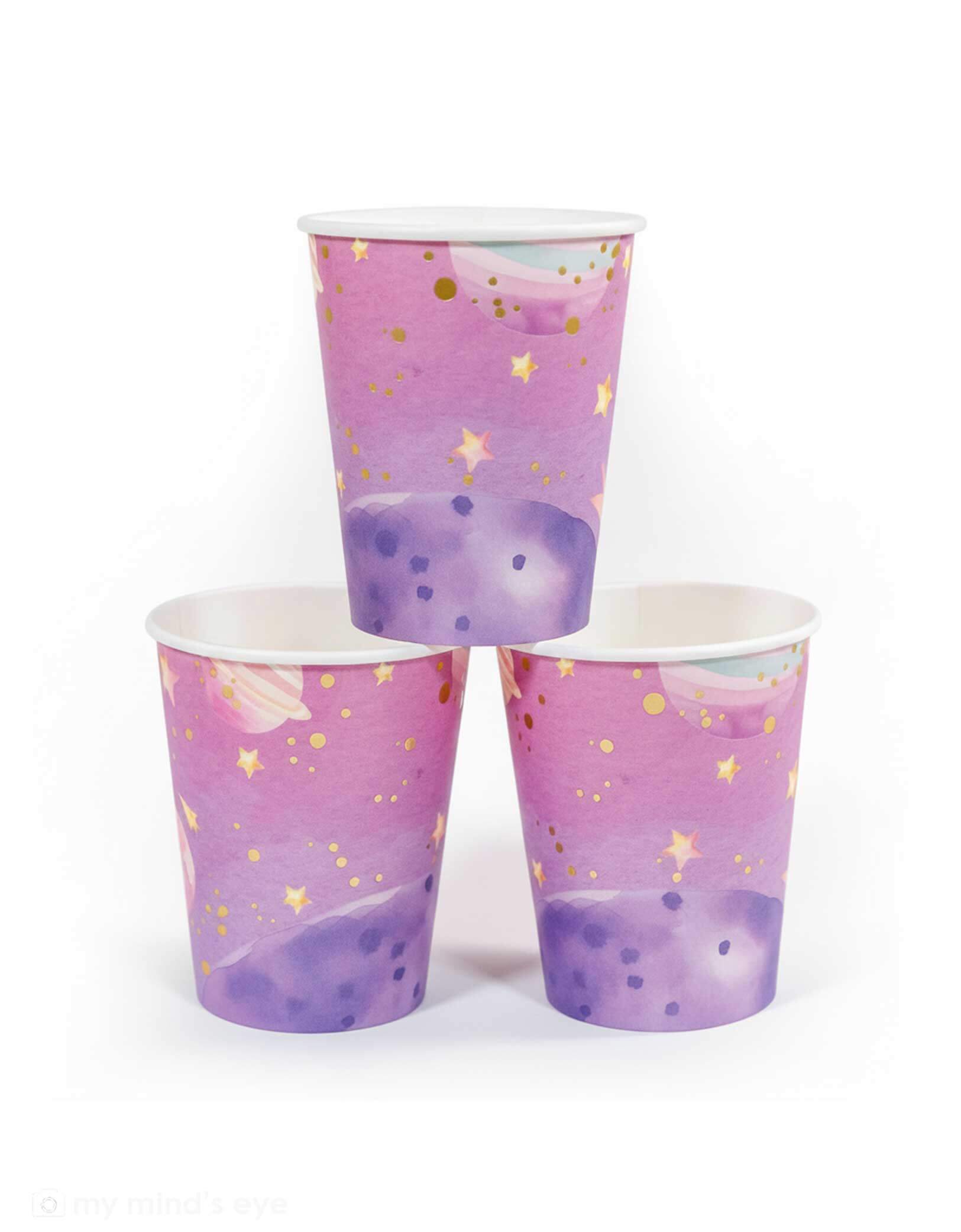 Momo Party's 9oz pink galaxy space themed paper cups with star patterns on a white background.