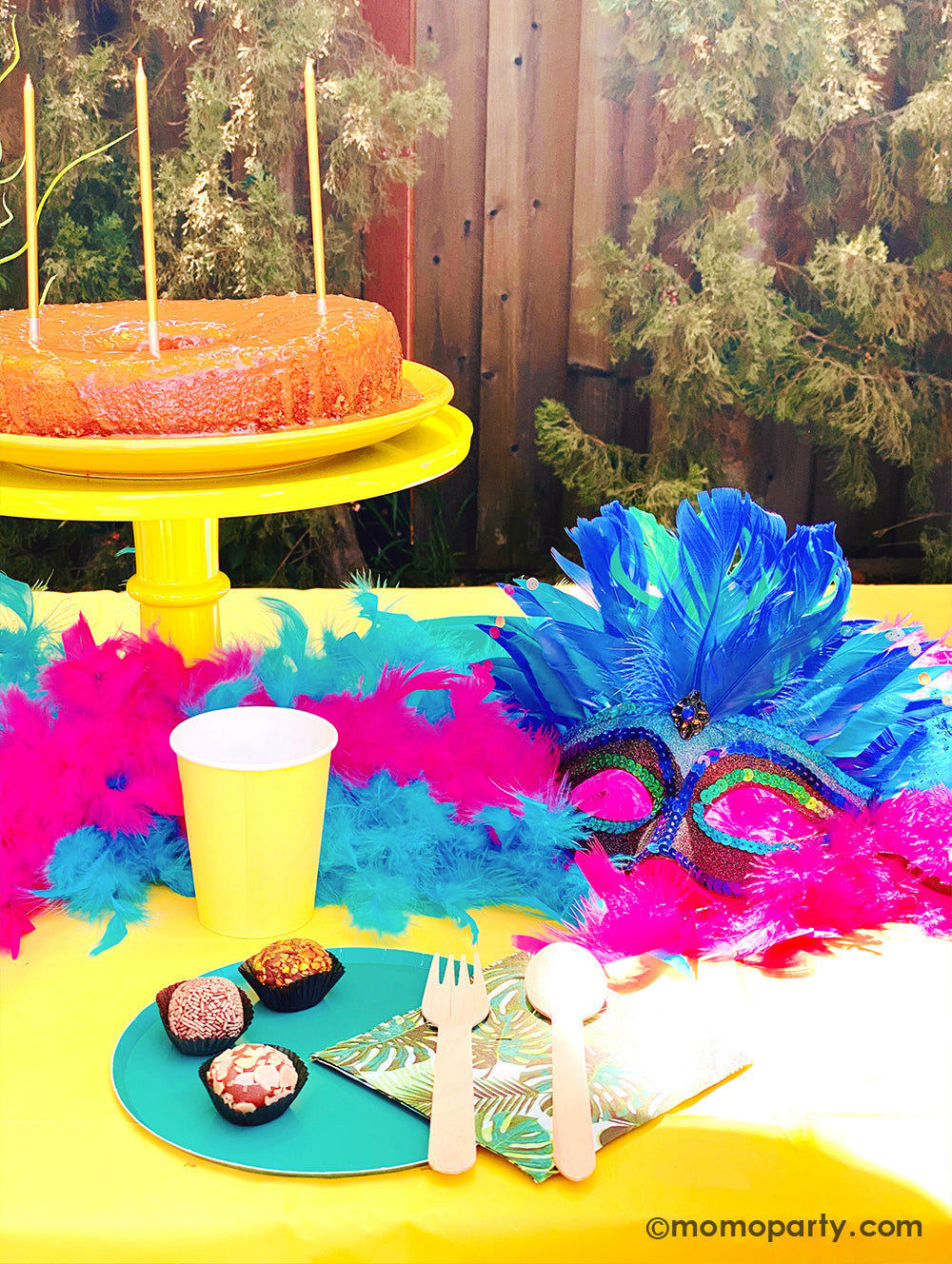 Get ready to throw the ultimate summer celebration with a vibrant Brazilian Carnival-themed party table! Featuring tropical party supplies from Momo Party, this festive setup includes palm leaf napkins, matching plates, and colorful party cups that bring the rainforest vibe to life. Complete the look with feather garlands, carnival masks, decadent chocolate desserts, and a stunning birthday cake. Whether it's for a birthday, summer bash, or themed event, this tropical party setup is perfect for summer!