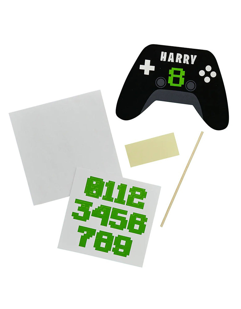 Momo Party's Video Game Console Controller shaped personalized Cake Topper by Hooty Balloo. Come with two sticker sheets, you can customize this cake topper with the birthday person's name and age. It's perfect for kid's video game themed birthday party.