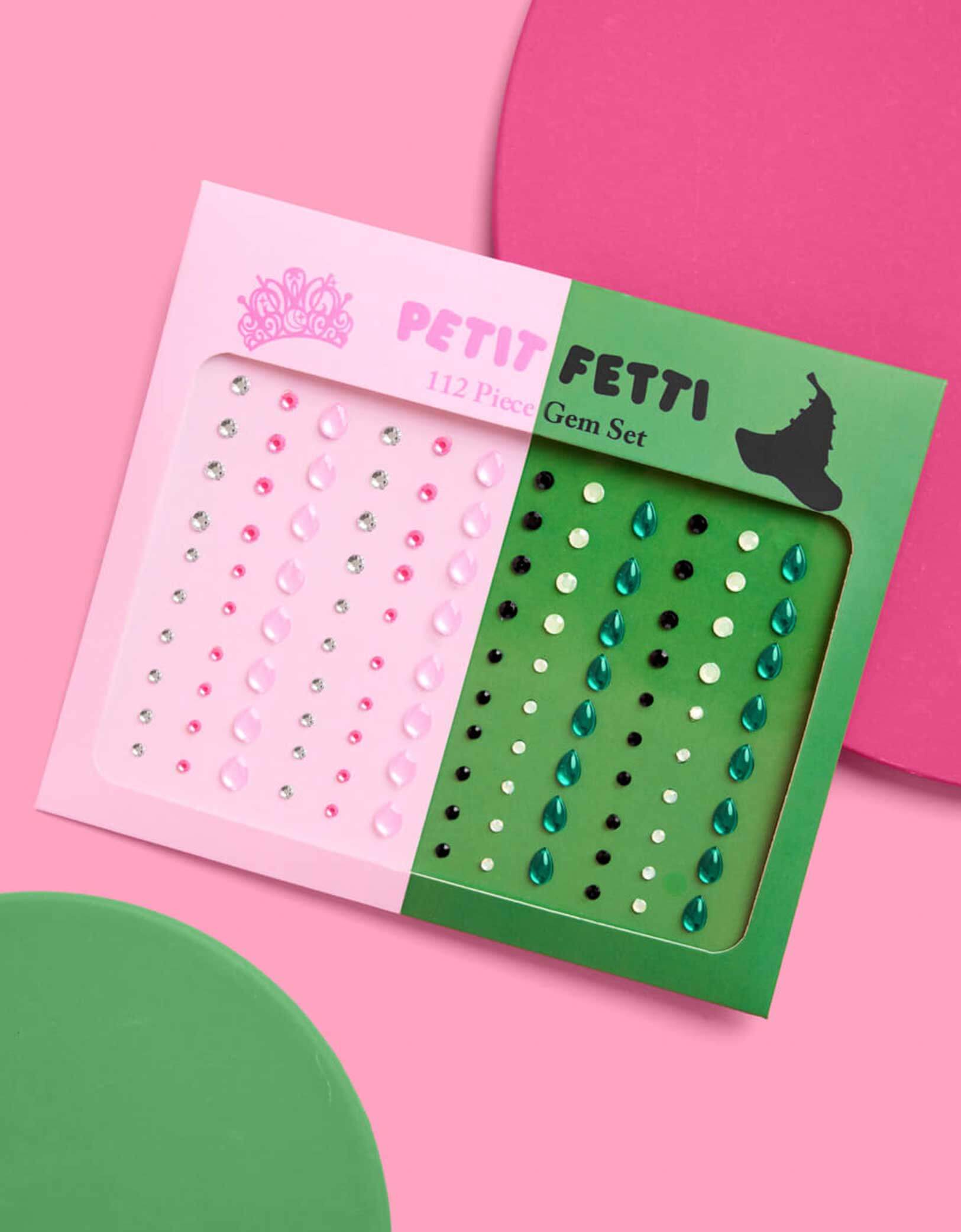Momo Party's Wicked Pink Green Face Gem Set featuring two gem sets in pink and green packaging on a pink background. Comes in 112 pieces, these adhesive gems stick easily and stay put, ensuring your look shines brightly throughout the entire night.