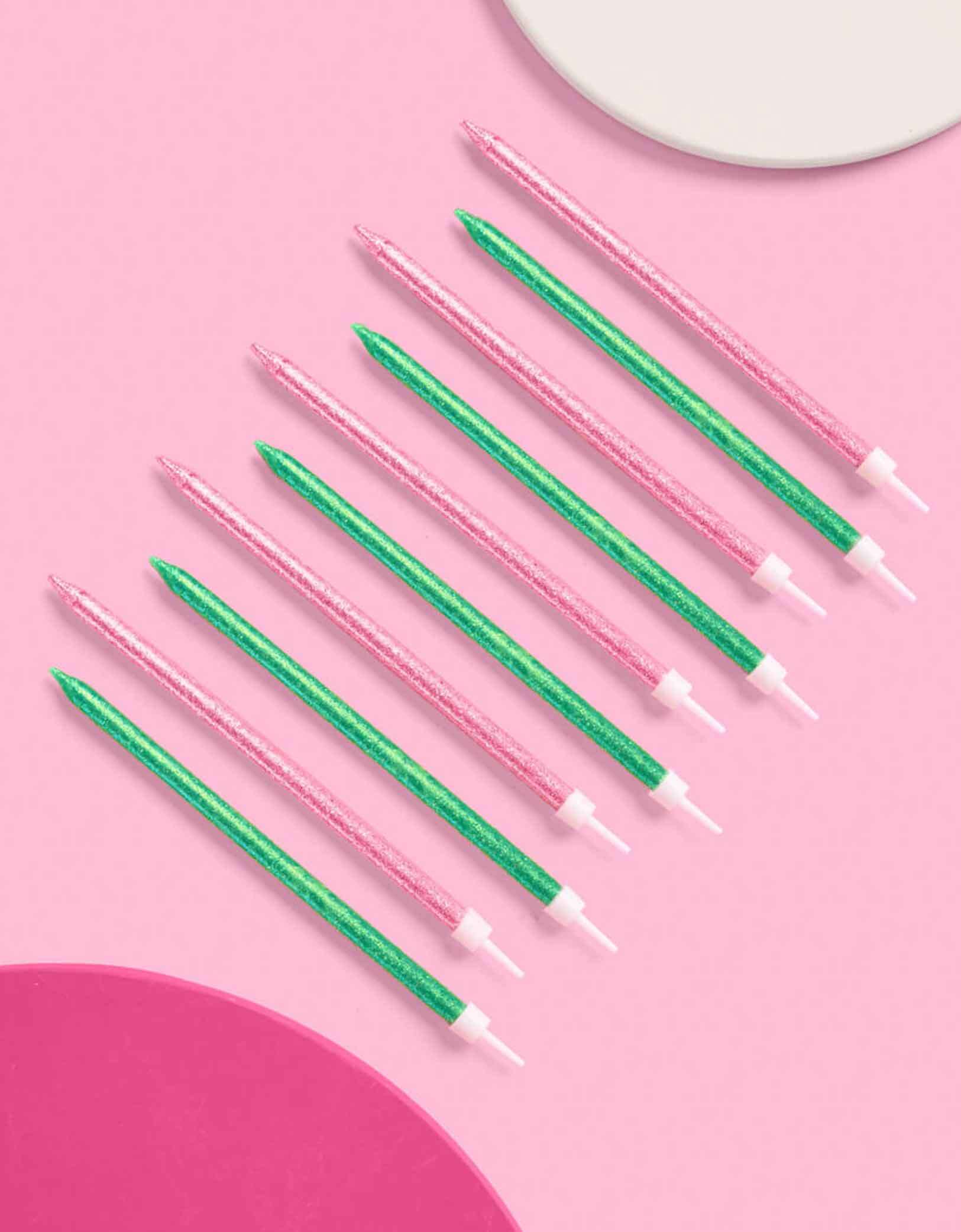 Momo Party's Wicked Party Green and pink glittered birthday candles by Xo, Fetti on a pink background.