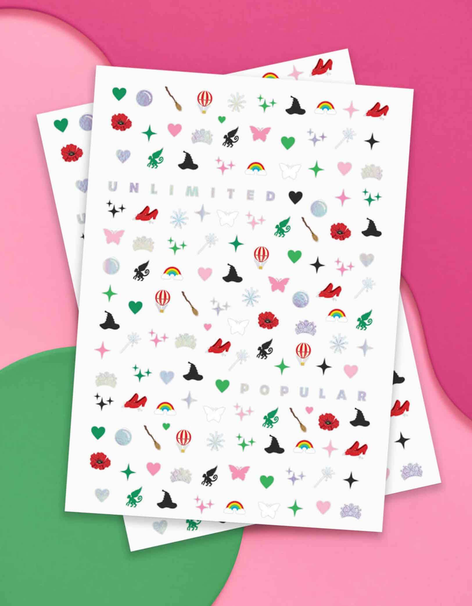 Momo Party's Wicked Emerald City Nail Stickers by Xo, Fetti on a pink and green background, featuring wicked themed elements including witch hats, bubbles, hot air balloons, butterflies, tiaras, rainbows, sparkles, witch's brooms, they’re perfect for a fun, themed activity that lets guests express their playful side. Easy to apply and remove, these stickers bring a splash of fantasy to your fingertips, making every celebration a little more spellbinding.