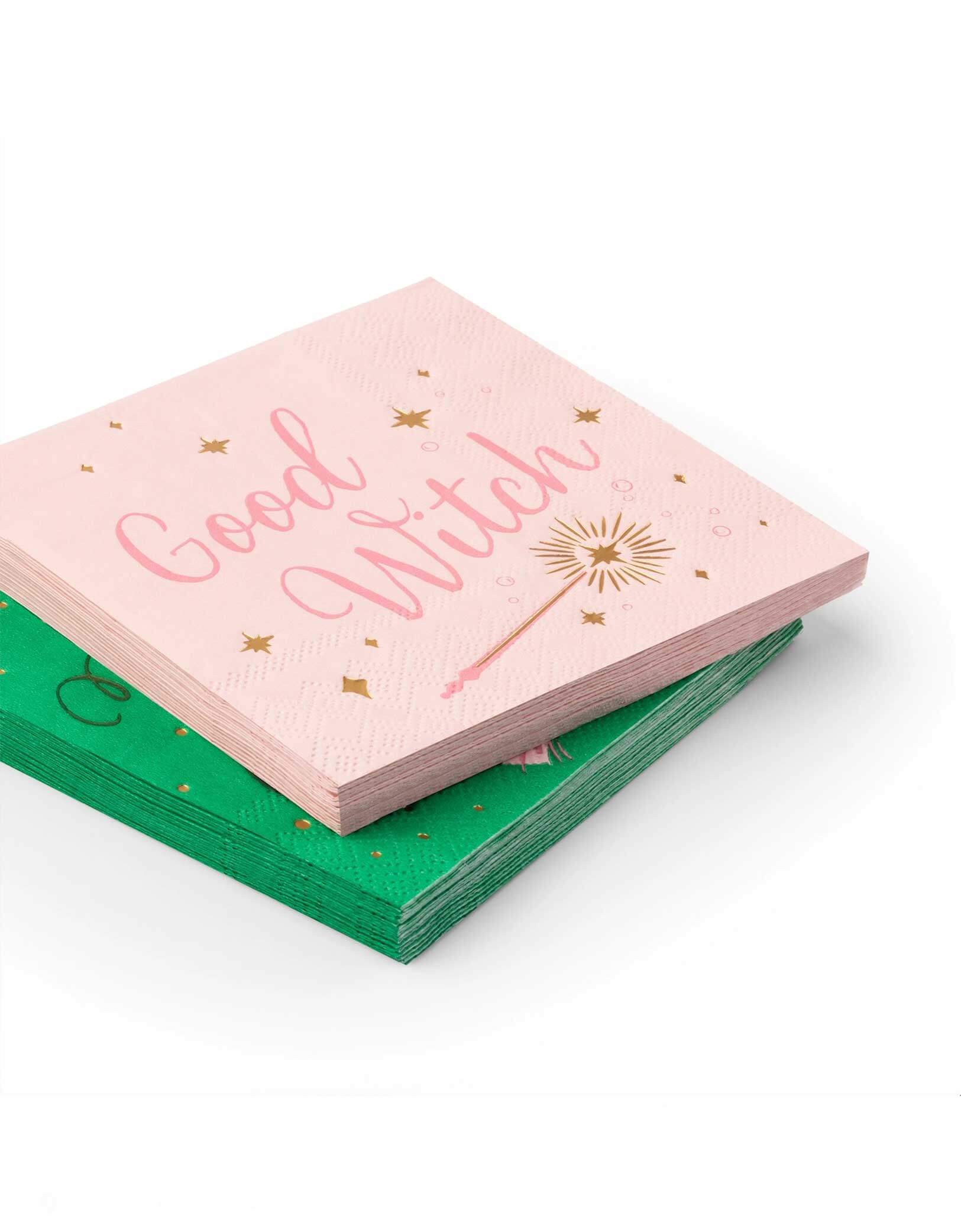 Momo Party's 5" pink and green small napkins with 'Good Witch' text on a white background.