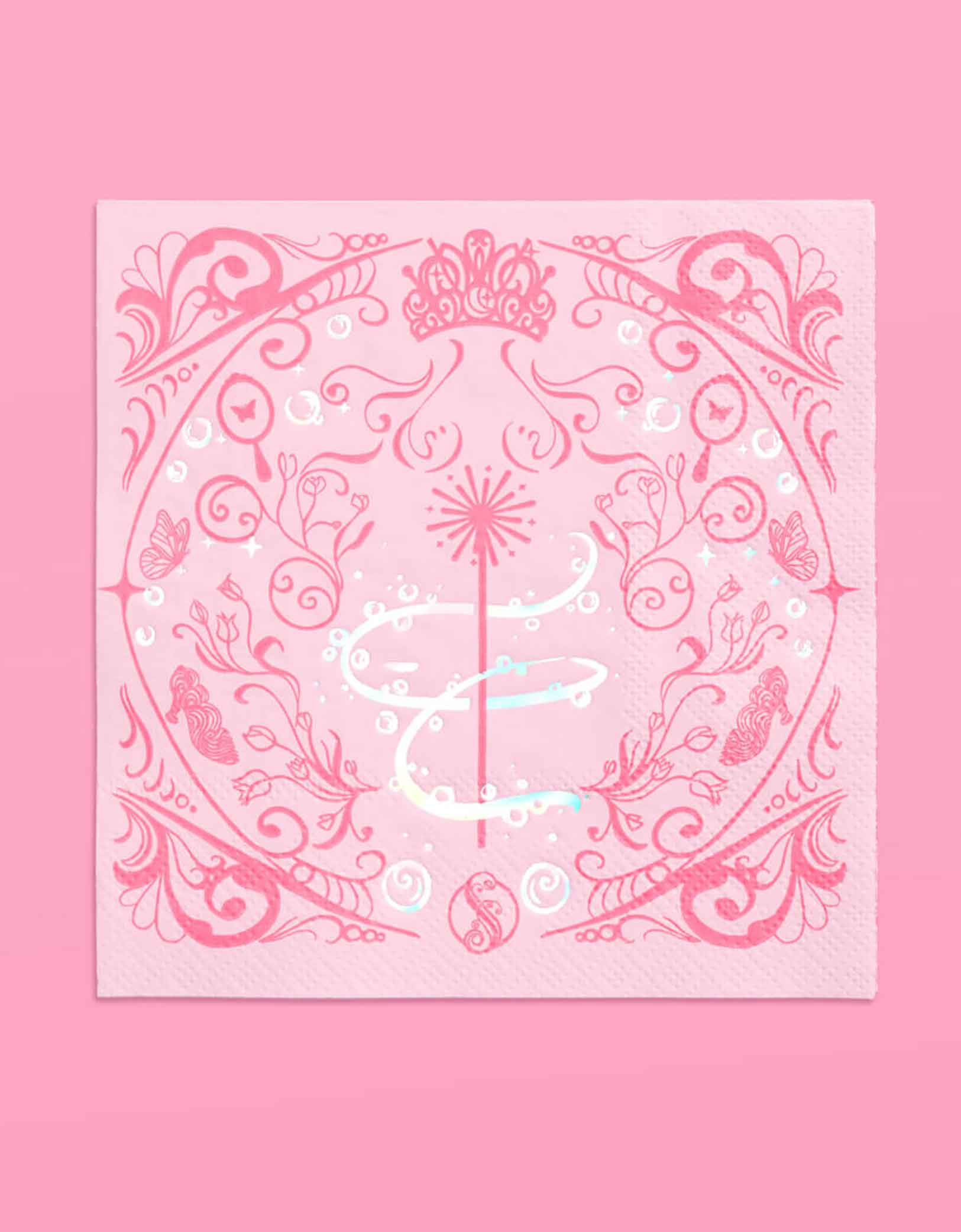 Momo Party's 5" Wicked party paper napkins in pink with intricate wizard and Glinda inspired designs on a pink background.
