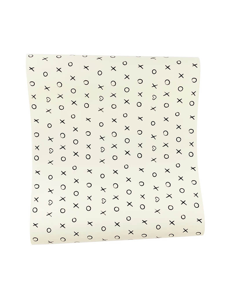 Momo Party's 16" x 120" black and white XOXO Paper Table Runner by My Mind's Eye. This playful yet sophisticated runner will add a little oomph to your Valentine's Day tablescape, with its sweet black and white xoxo print.