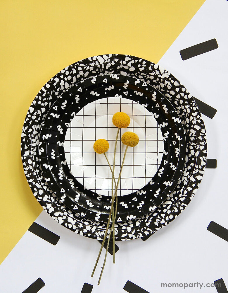 BASH Party Goods - Art School Speckle Large Plates in black layered with Art School Squiggle Small Plates layered and Grid 4.25" Mini Canape Plate and Craspedia Billy Balls. Mix and match grids, squiggles, and speckles for the perfect bold accent for a modern party