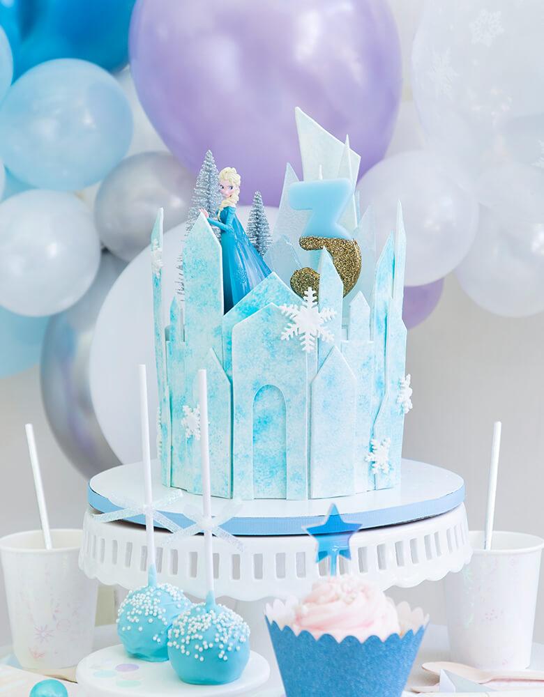Talking Tables - We Heart Birthday Glitter Number Candle Blue number 3 on a Frozen Themed icy castle cake with Elsa Princess figure toy for a 3 years girl's birthday