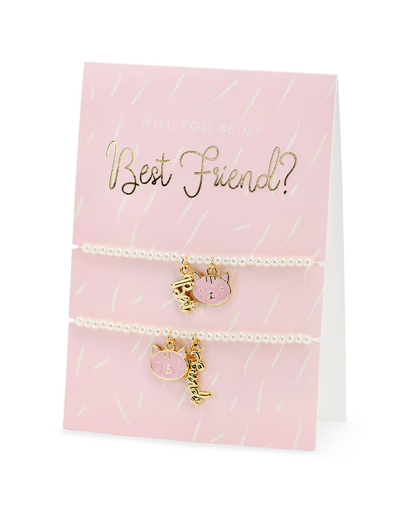 Party Deco - Best Friends Bracelets Card. featuring two bracelets with kitty chain and "best" "friend" gold word chain on a card. This adorable card with two kitty cat bracelets comes with a cute envelope. It's perfect for your little one's Valentine's exchange!