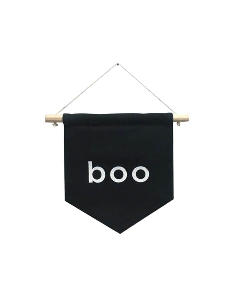 Imani Collective - Boo Hang Sign.  7 x 6.5 inches,  Black canvas,  Poplar dowel rod and cotton thread sourced from Kenya Made in Kenya. This "Boo." Sewn and screen printed by hand on black canvas by Kenyan artisans. So unique and cute for little one's halloween room decoration. 