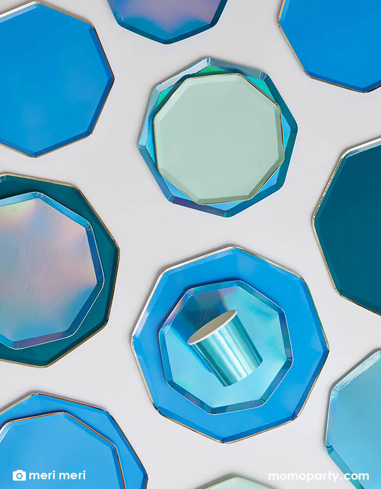 A beautiful range of Meri Meri's blue themed tableware including Meri Meri 10.25 inches bright blue octagonal dinner plates with gold foil edge, tumbler cups, and side plates with gold foil edge