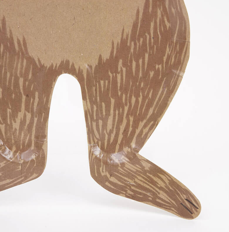 close up details of Meri Meri Brown Bear Large Plates. Featuring a whole body look Brown bear die cut shaped paper plate, They are crafted from uncoated art paper for a natural look. They are ideal for a woodland themed party or whenever you want to bring the beauty of nature to the party table.