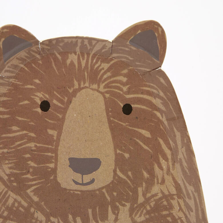 close up details of Meri Meri Brown Bear Large Plates. Featuring a whole body look Brown bear die cut shaped paper plate, They are crafted from uncoated art paper for a natural look. They are ideal for a woodland themed party or whenever you want to bring the beauty of nature to the party table.